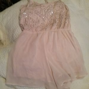 Peach color romper with lots of bling